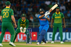 Rohit Sharma playing an attacking shot against South African bowlers during the India vs South Africa cricket match, with wicketkeeper and fielders in action.