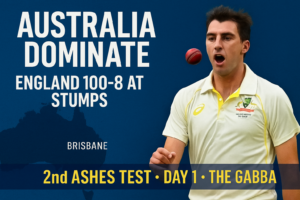 News graphic showing Australia dominating Day 1 of the Ashes Second Test, featuring an Australian fast bowler with a pink ball and headline text reading ‘Australia Dominate – England 100-8 at Stumps’.